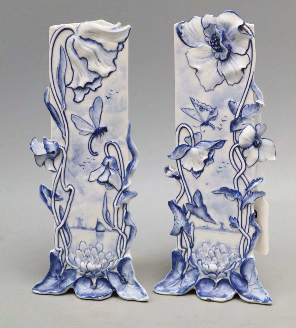 A pair of Delft Art Nouveau blue and white vases, height 21cm